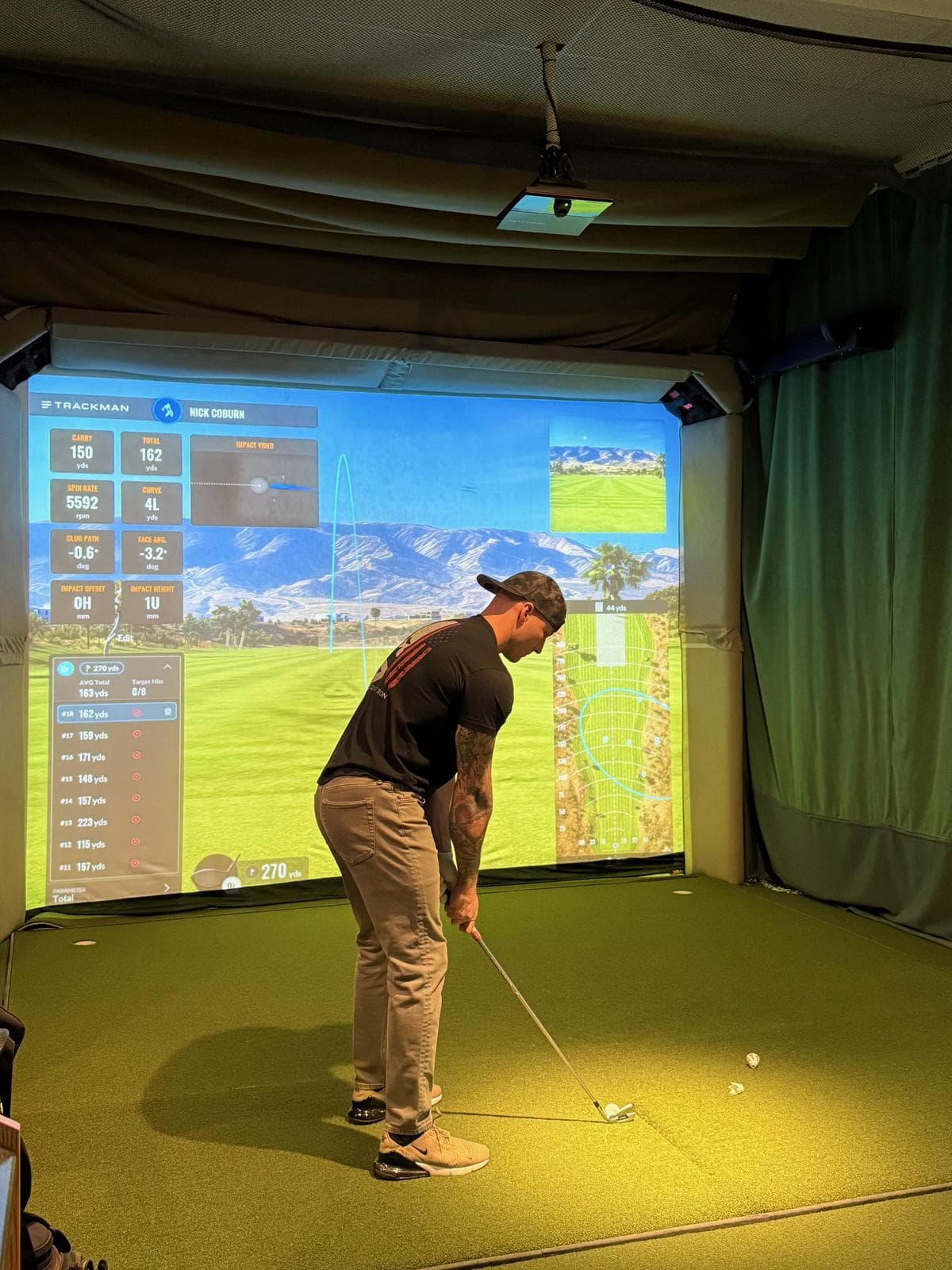 Golfer using TrackMan simulator at Gonzo's HD Sports